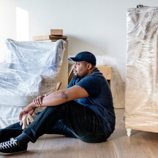 black-man-moving-furniture_53876-71843
