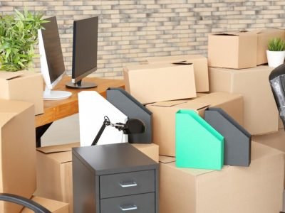 carton-boxes-with-stuff-room-office-move-concept_392895-367853