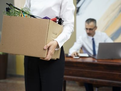 woman-carrying-cardboard-box-side-view