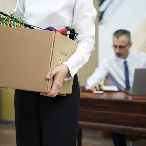 woman-carrying-cardboard-box-side-view